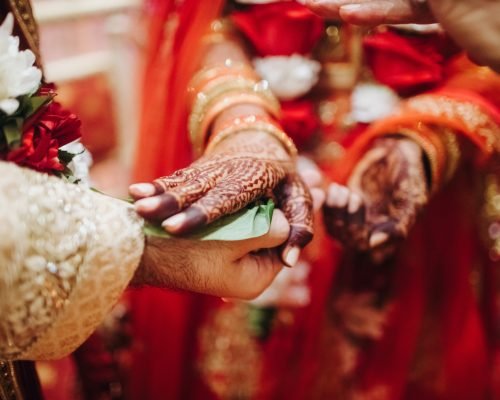 Ritual with coconut leaves during traditional Hindu wedding ceremony