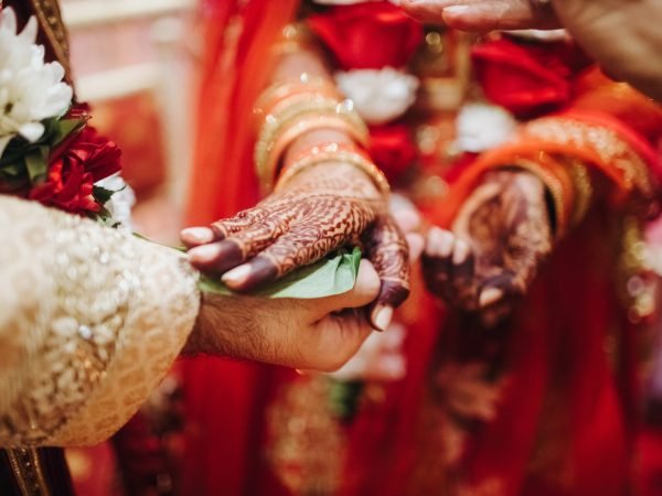 Ritual with coconut leaves during traditional Hindu wedding ceremony